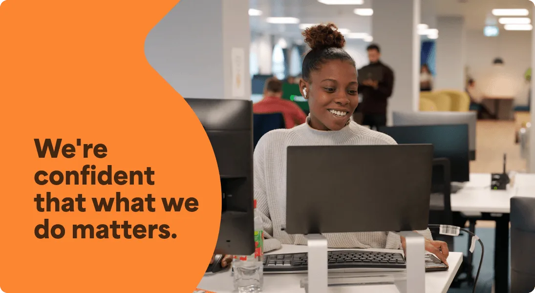 A photo of a woman working at her desk. It has a text overlay that says We're confident that what we do matters.