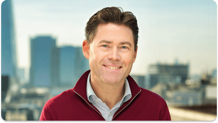 A photo of Adrian Blair, Chief Executive Officer at Trustpilot